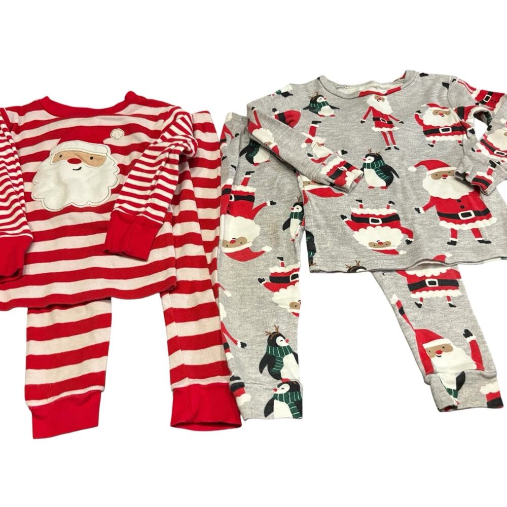 Two sets of Boys 18M Christmas pajamas featuring Santa